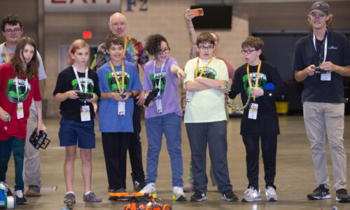 Students driving Battlebots at the 3DPrintopia Deathraces