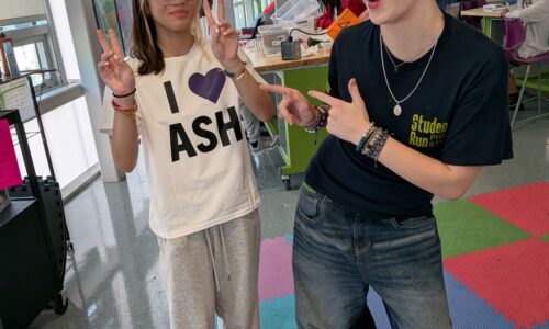 Ash & Eliyana modeling a shirt they designed.