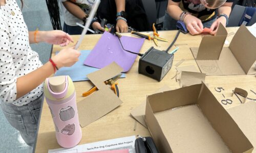 Students designing cardboard prototypes in Pre-Engineering